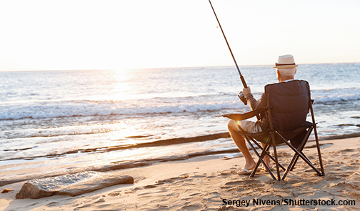 elderly man fishing in sun